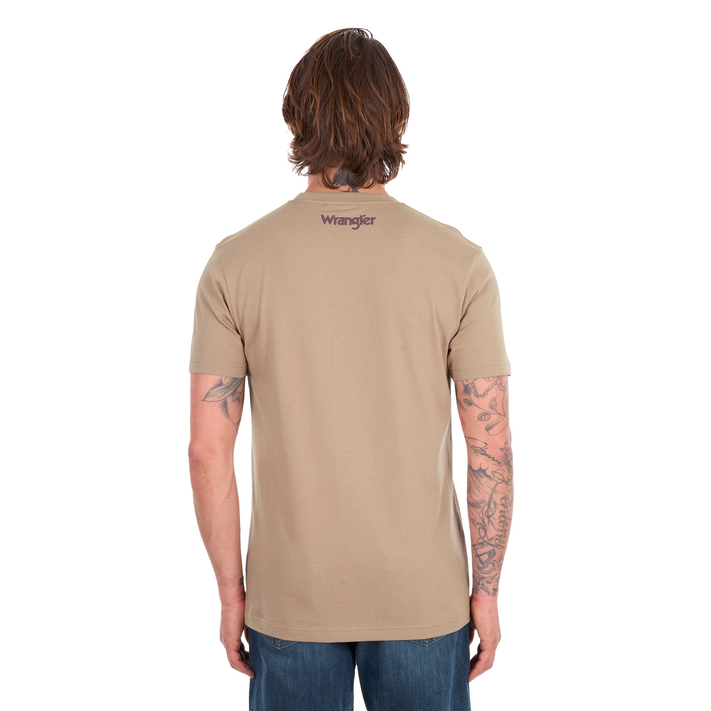 A man viewed from behind wearing a tan Wrangler Men's James Short Sleeve T-Shirt (XCP1557686) with a logo back neck print, paired with blue jeans, photographed against a solid white background.