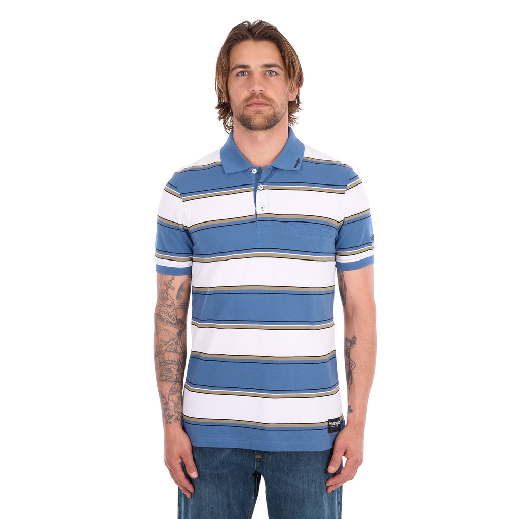 A man wearing a denim blue and white Wrangler Men's Mick Short Sleeve Polo (X6S1560679) with thin tan stripes, paired with blue jeans, photographed against a solid white background.