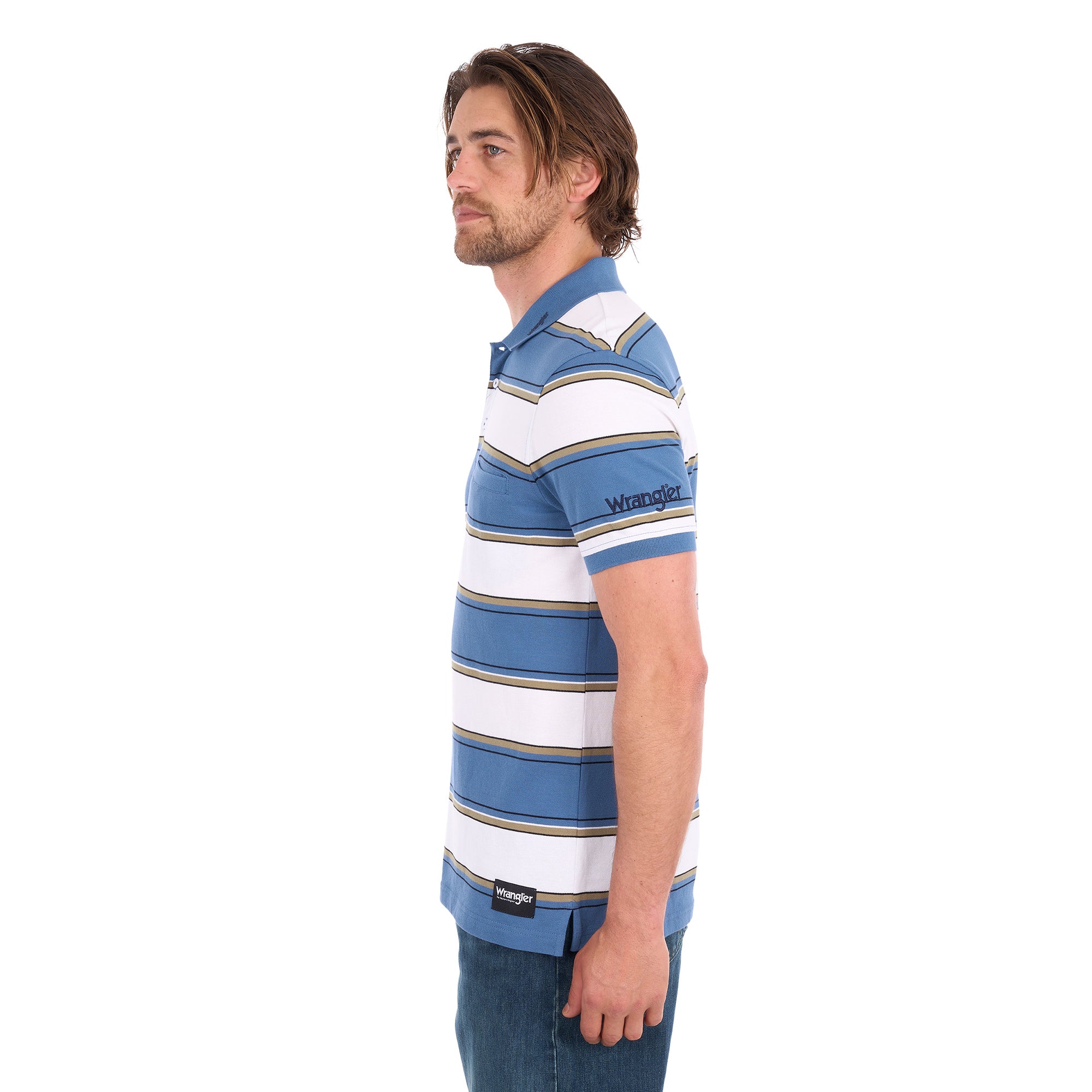 A man in profile wearing a denim blue and white Wrangler Men's Mick Short Sleeve Polo (X6S1560679) with thin tan stripes, paired with blue jeans, photographed against a solid white background.