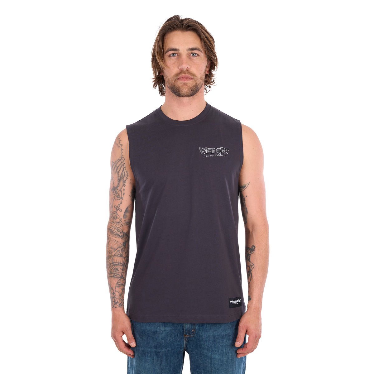 A man facing the camera wearing a Wrangler Mens Paul Muscle Tank (XCP1572700) in Charcoal with a pair of denim jeans.