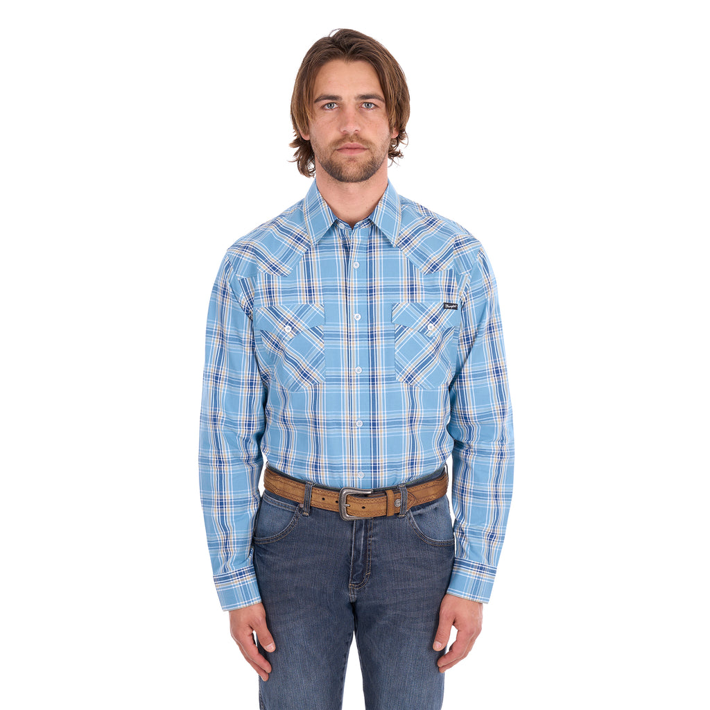 A man wearing a teal and tan Wrangler Men's Zak L/S Shirt (X6S1111668) with a brown belt and dark blue jeans, standing against a solid white background.