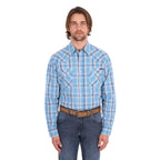 A man wearing a teal and tan Wrangler Men's Zak L/S Shirt (X6S1111668) with a brown belt and dark blue jeans, standing against a solid white background.