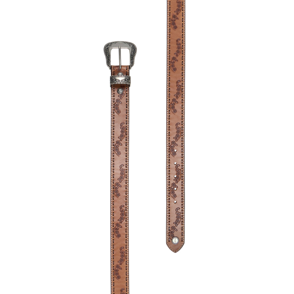 A light tan, floral embossed leather Wrangler Silvie Belt (X6S2920BLT) with leather lacing, featuring an engraved silver-tone buckle, matching keeper and logo concho photographed in flat lay on a white background.