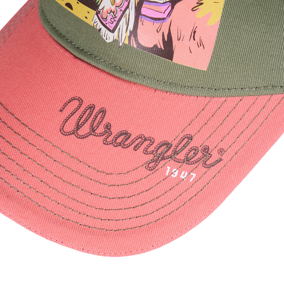 The front and peak of the Wrangler Willa High Profile Trucker Cap (X6S2942CAP) in Khaki Marle/Coral featuring a retro western cowgirl print and Wrangler logo.