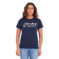 A woman modelling a navy blue Wrangler Belle Tee (X6S2598643) with a yellow and white Wrangler graphic print on the chest, paired with light blue jeans, against a plain white background.