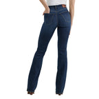 A woman photographed from the waist down modelling a pair of Lacey Wrangler Women's Bespoke Hi Rise Bootcut Jeans (112359277) with brown boots on a white background.