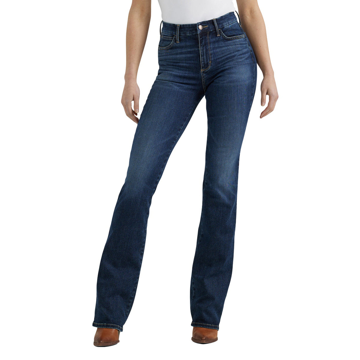 A woman photographed from the waist down modelling a pair of Lacey Wrangler Women's Bespoke Hi Rise Bootcut Jeans (112359277) with brown boots on a white background.