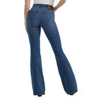 A woman shown from the waist down modelling a pair of Wrangler Women's Bespoke Hi Rise Flare Jeans (112359281) paired with a white tee and brown pointed boots on a white background.