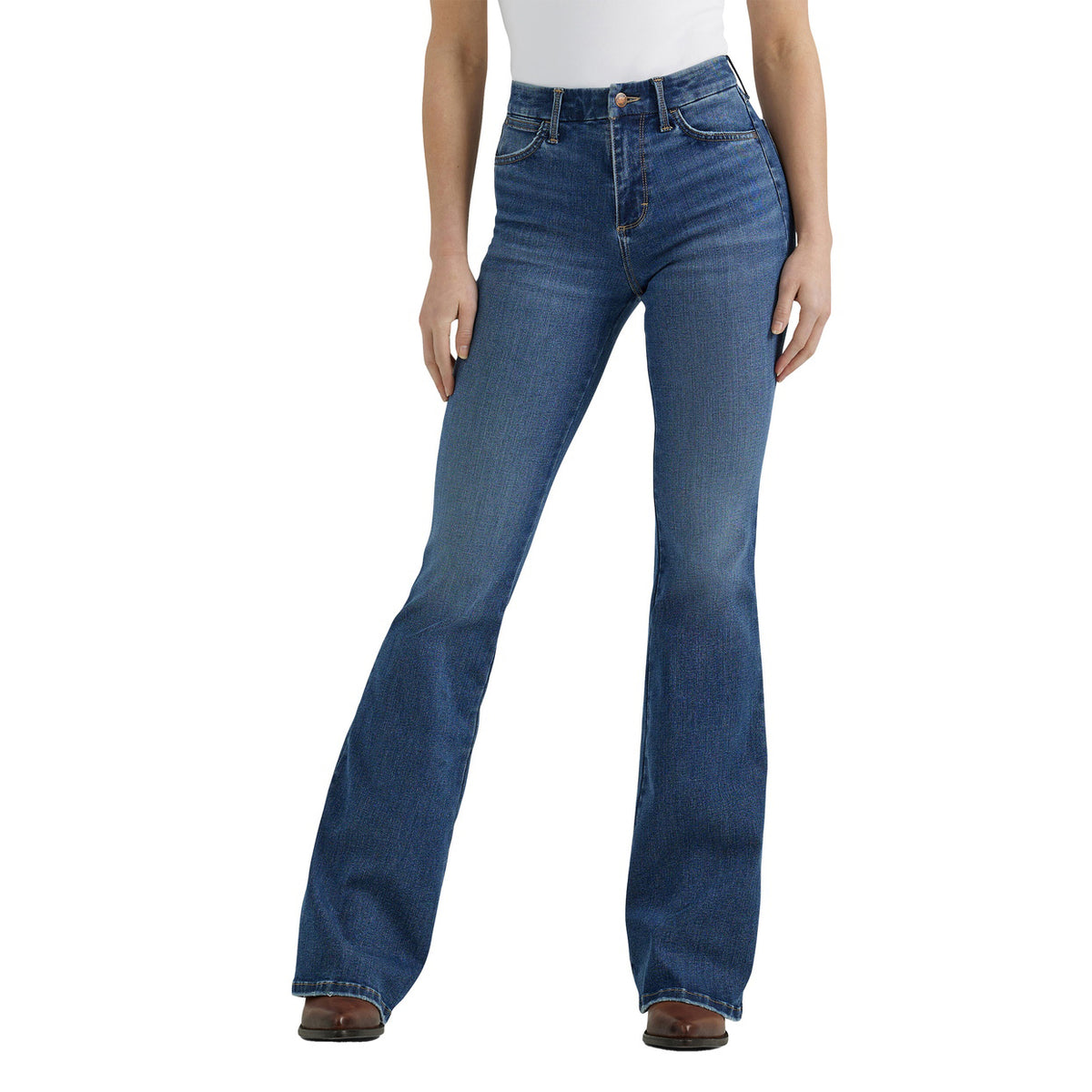 A woman shown from the waist down modelling a pair of Wrangler Women's Bespoke Hi Rise Flare Jeans (112359281) paired with a white tee and brown pointed boots on a white background.