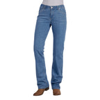 A woman wearing faded blue Wrangler Women's Chara Willow Jeans (XCP2251216) and brown cowboy boots, shown against a plain white background.