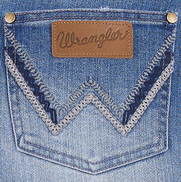 Close-up of the back pocket embroidery on the Wrangler Women's Emmie Denim Skirt (X6S2410724) with brown leather Wrangler brand patch.