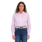 A woman in profile modelling a pink and blue Wrangler Women's Essie Long Sleeve Shirt (X6S2101601) with blue jeans and a western stone coloured Wrangler Zola Belt (XCP2918BLT), set against a plain white background.