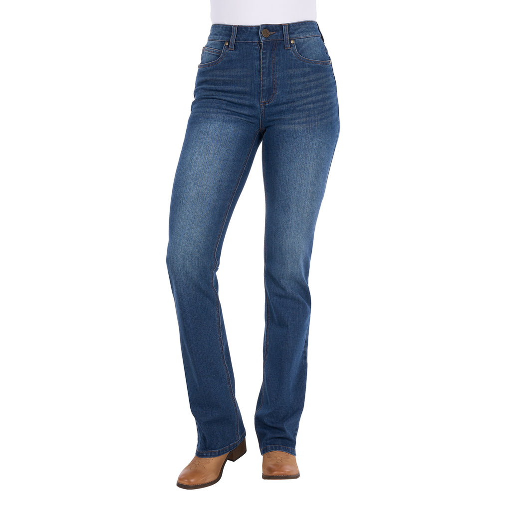 A woman wearing mid indigo blue western-style Wrangler Women's Etta Bootcut Jeans Bailey (XCP2255711) with a white top and tan boots, shown against a plain white background.