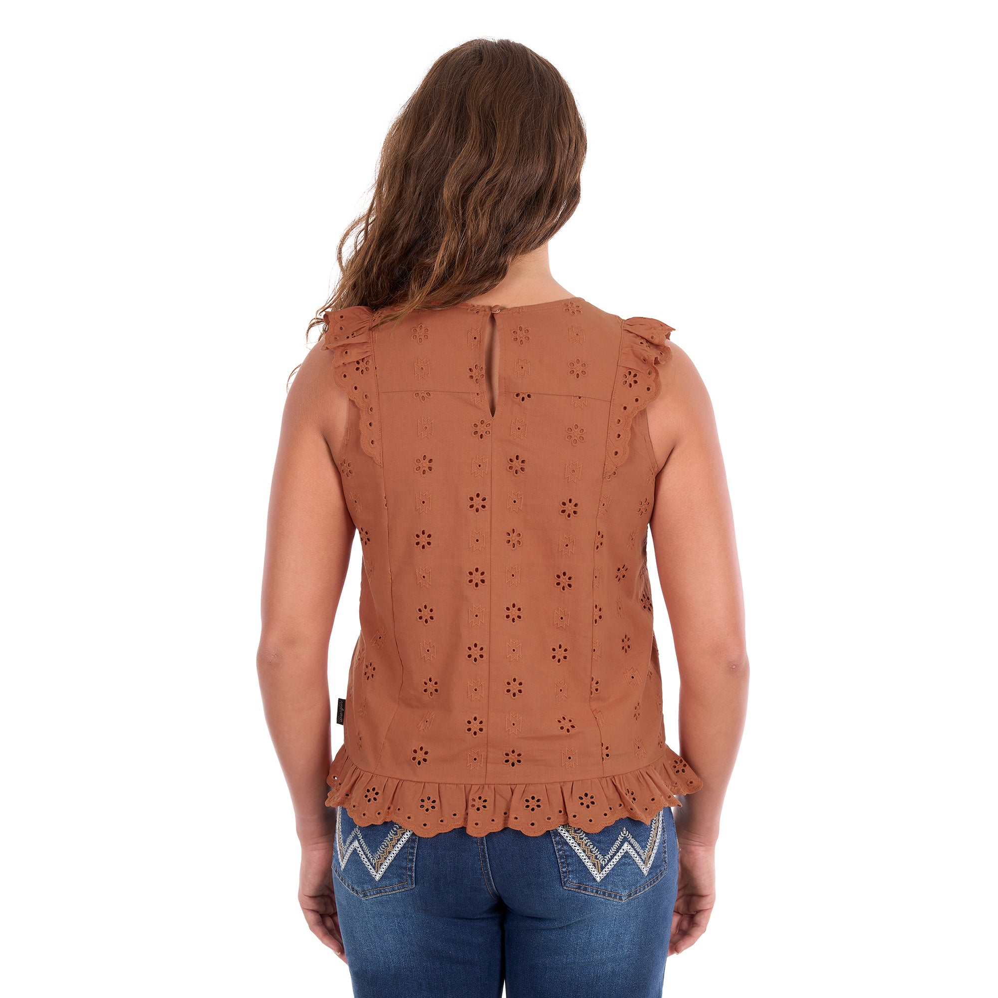 A woman viewed from behind modelling a copper Wrangler Women's Grace Sleeveless Blouse (X6S2502615) with eyelet embroidery and a ruffled hem, paired with blue jeans, against a plain white background.