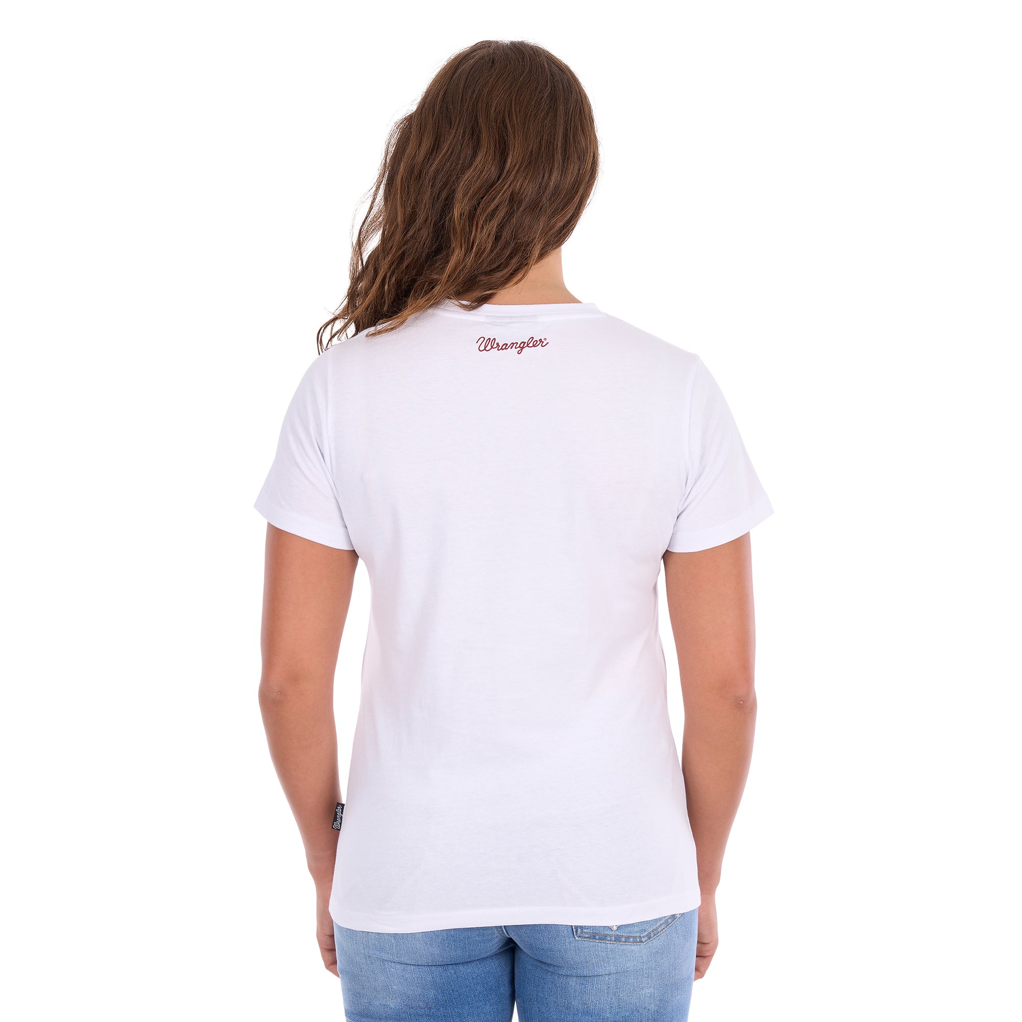 A woman viewed from the back wearing a Wrangler Women's Gwen (X6S2598635) White t-shirt with a small red script logo on the upper back, paired with blue jeans against a plain white background.