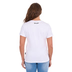 Back view of a woman modelling a white graphic Wrangler Women's Josie Short Sleeve T-Shirt (XCP2598641) with a back neck Wrangler script logo, paired with blue jeans against a plain white background.