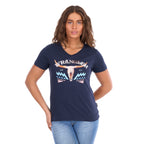 A woman modelling a navy blue Wrangler Women's Lana V-Neck T-Shirt (X6S2599634) with a western graphic on the chest, paired with light blue jeans, against a plain white background.