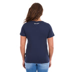 A woman viewed from behind modelling a navy blue Wrangler Women's Lana V-Neck T-Shirt (X6S2599634) with a Wrangler logo at the back neck, paired with light blue jeans, against a plain white background.