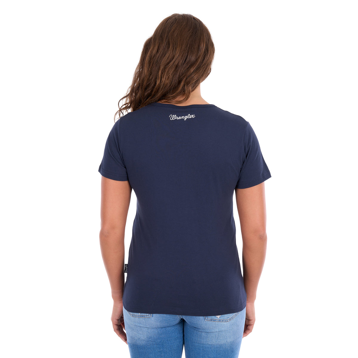 A woman viewed from behind modelling a navy blue Wrangler Women's Lana V-Neck T-Shirt (X6S2599634) with a Wrangler logo at the back neck, paired with light blue jeans, against a plain white background.