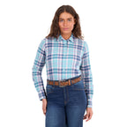 A woman modelling a pink and teal Wrangler Women's Luisa Long Sleeve Shirt (X6S2100607), paired with blue jeans and a tan Wrangler Siara Western Belt (X6S2916BLT), against a plain white background.