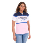 A woman modelling a Pink and Navy Wrangler Women's Maeve S/S Polo (X6S2513627) with a colour-blocked design in navy blue, white, and light pink, paired with blue jeans against a plain white background.