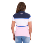 A woman modelling a Pink and Navy Wrangler Women's Maeve S/S Polo (X6S2513627) with a colour-blocked design in navy blue, white, and light pink, paired with blue jeans against a plain white background, photographed from behind.