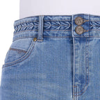 Close-up of the faded blue Wrangler Women's Maisy Denim Skirt (XCP2409723) showing the waistband with braided detailing, double button closure, belt loops, and front pocket with W embroidery.