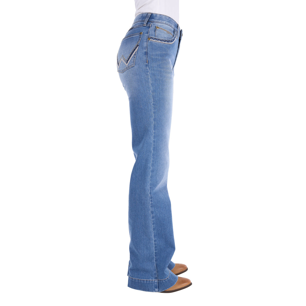 Profile view of a person wearing light blue Wrangler Women's Margo Trouser Jeans Willow (XCP2253710) with a straight-to-flare leg and decorative contrast stitching on the pockets, shown against a plain white background.