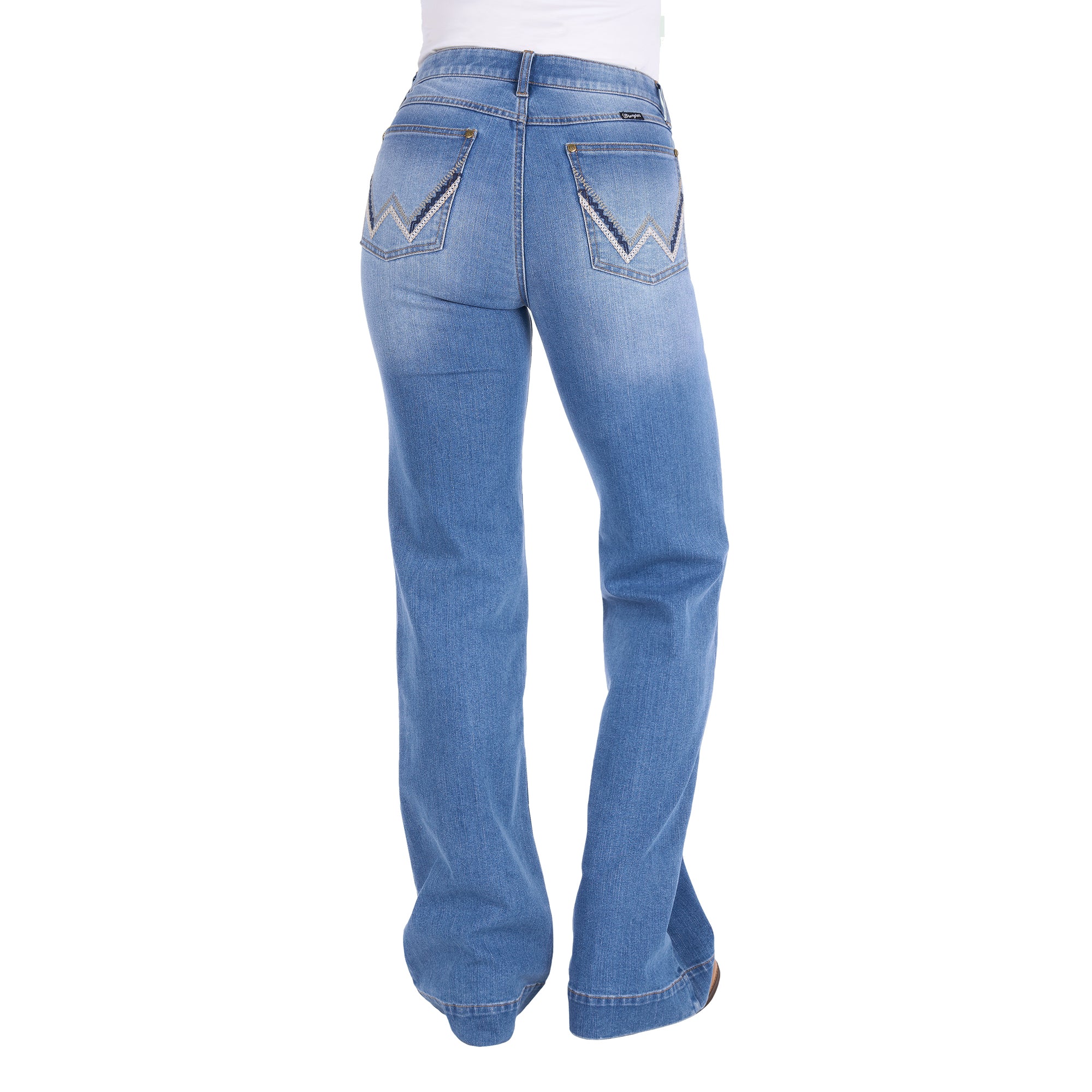Rear view of a person wearing light blue Wrangler Women's Margo Trouser Jeans Willow (XCP2253710) with a straight-to-flare leg and decorative contrast stitching on the back pockets, shown against a plain white background.