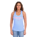 A woman modelling a light blue Wrangler Womens Maya Tank (X6S2508649) with 'Wrangler Jeans' appliqued and embroidered in pink and white across the chest, paired with blue jeans against a plain white background.