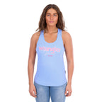 A woman modelling a light blue Wrangler Womens Maya Tank (X6S2508649) with 'Wrangler Jeans' appliqued and embroidered in pink and white across the chest, paired with blue jeans against a plain white background.