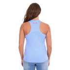 A woman viewed from the back wearing a light blue Wrangler Womens Maya Tank (X6S2508649) racerback top with a shirred panel and a small pink 'Wrangler' logo on the inner neck, paired with light blue jeans against a white background.