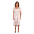 A woman modelling a cream Wrangler Women's Renee Short Sleeved Dress (X6S2407621) with a square neckline and a delicate western floral print on a light cream background, paired with brown ankle boots, set against a plain white background.