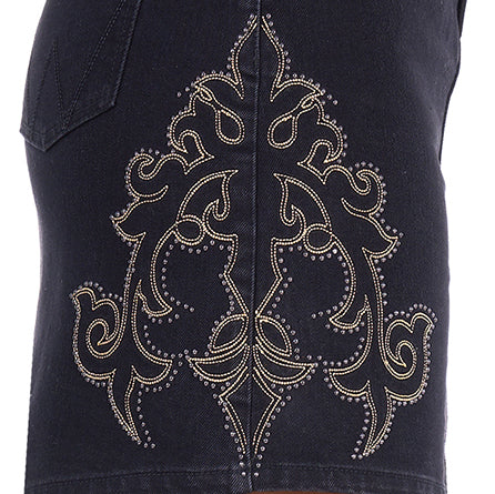 Close-up embroidery and stud detail on a black Wrangler Women's Rock Denim Skirt (X6S2409725) featuring a large ornate western-style embroidered pattern with small metallic studs.