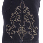 Close-up embroidery and stud detail on a black Wrangler Women's Rock Denim Skirt (X6S2409725) featuring a large ornate western-style embroidered pattern with small metallic studs.