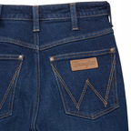 Close up back pocket detail on a pair of flat laid Kayla blue Wrangler Women's Rodeo Bootcut Jeans (112367606) on a white studio background.