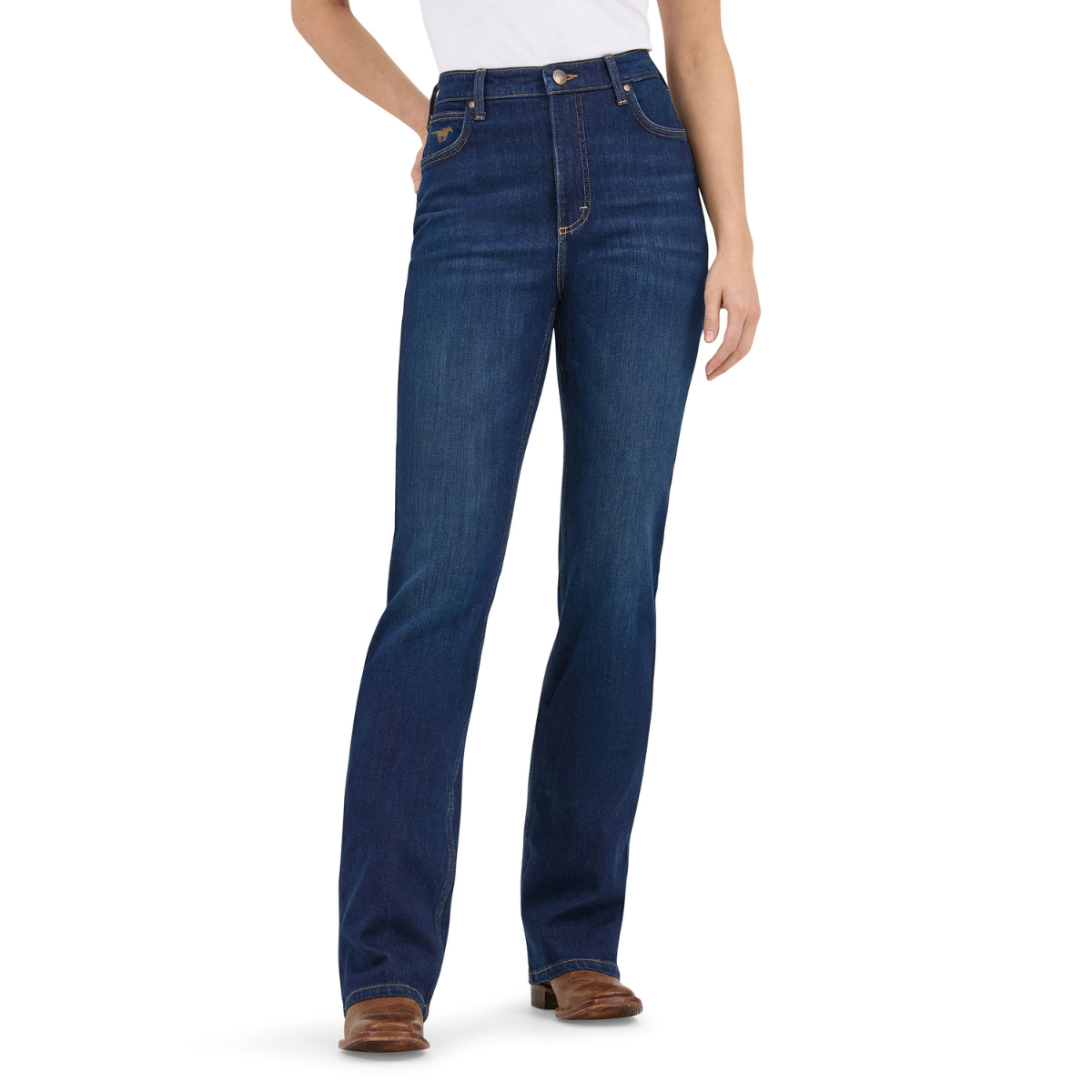 A woman shown from the waist down modelling a pair of Kayla blue Wrangler Women's Rodeo Bootcut Jeans (112367606) paired with a white top and brown western boots on a white studio background.