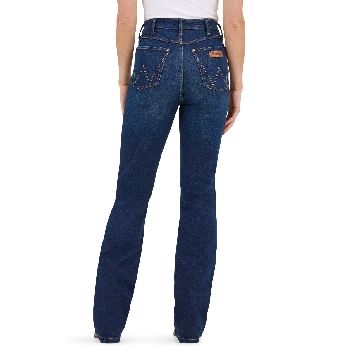 A woman shown from the waist down modelling a pair of Kayla blue Wrangler Women's Rodeo Bootcut Jeans (112367606) paired with a white top on a white studio background.