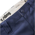 Close up waist detail on a pair of navy blue x/dmg Men's UP-1T Cargo Taped Work Pants (XU02506025) shown against a plain white background.