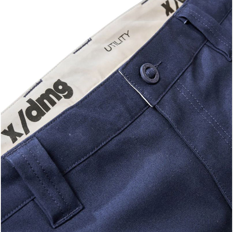 Close up waist detail on a pair of navy blue x/dmg Men's UP-1T Cargo Taped Work Pants (XU02506025) shown against a plain white background.