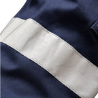 Close up tape detail on a pair of navy blue x/dmg Men's UP-1T Cargo Taped Work Pants (XU02506025) shown against a plain white background.