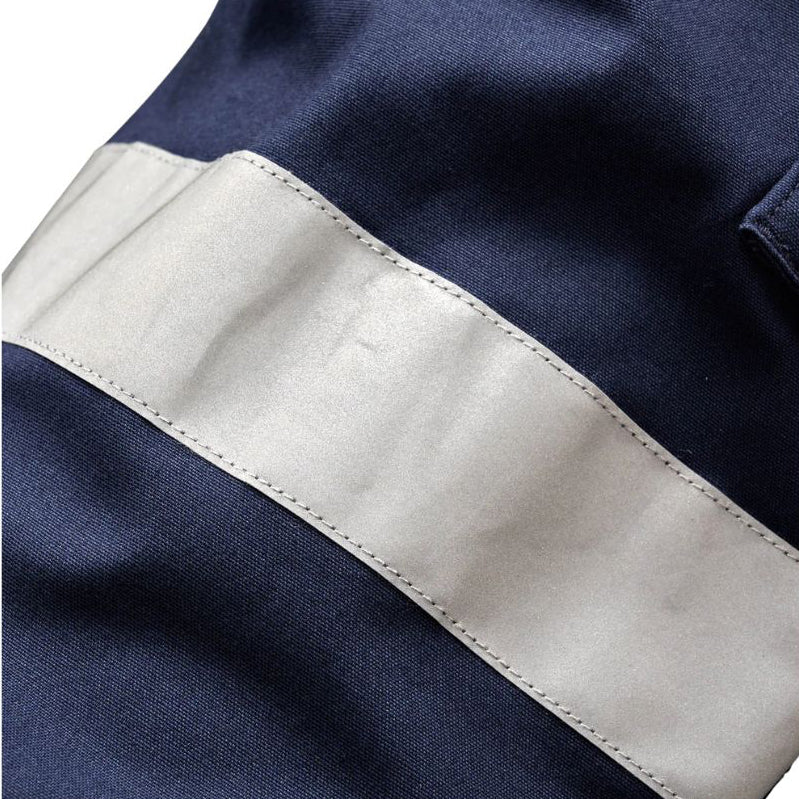 Close up tape detail on a pair of navy blue x/dmg Men's UP-1T Cargo Taped Work Pants (XU02506025) shown against a plain white background.
