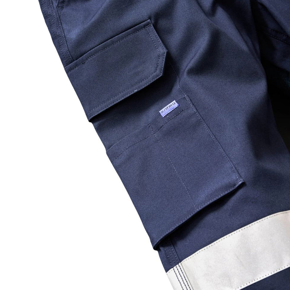 Close up pocket and tape detail on a pair of navy blue x/dmg Men's UP-1T Cargo Taped Work Pants (XU02506025) shown against a plain white background.